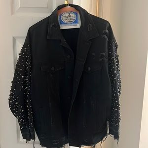 Oversized black denim jacket with beaded sleeves